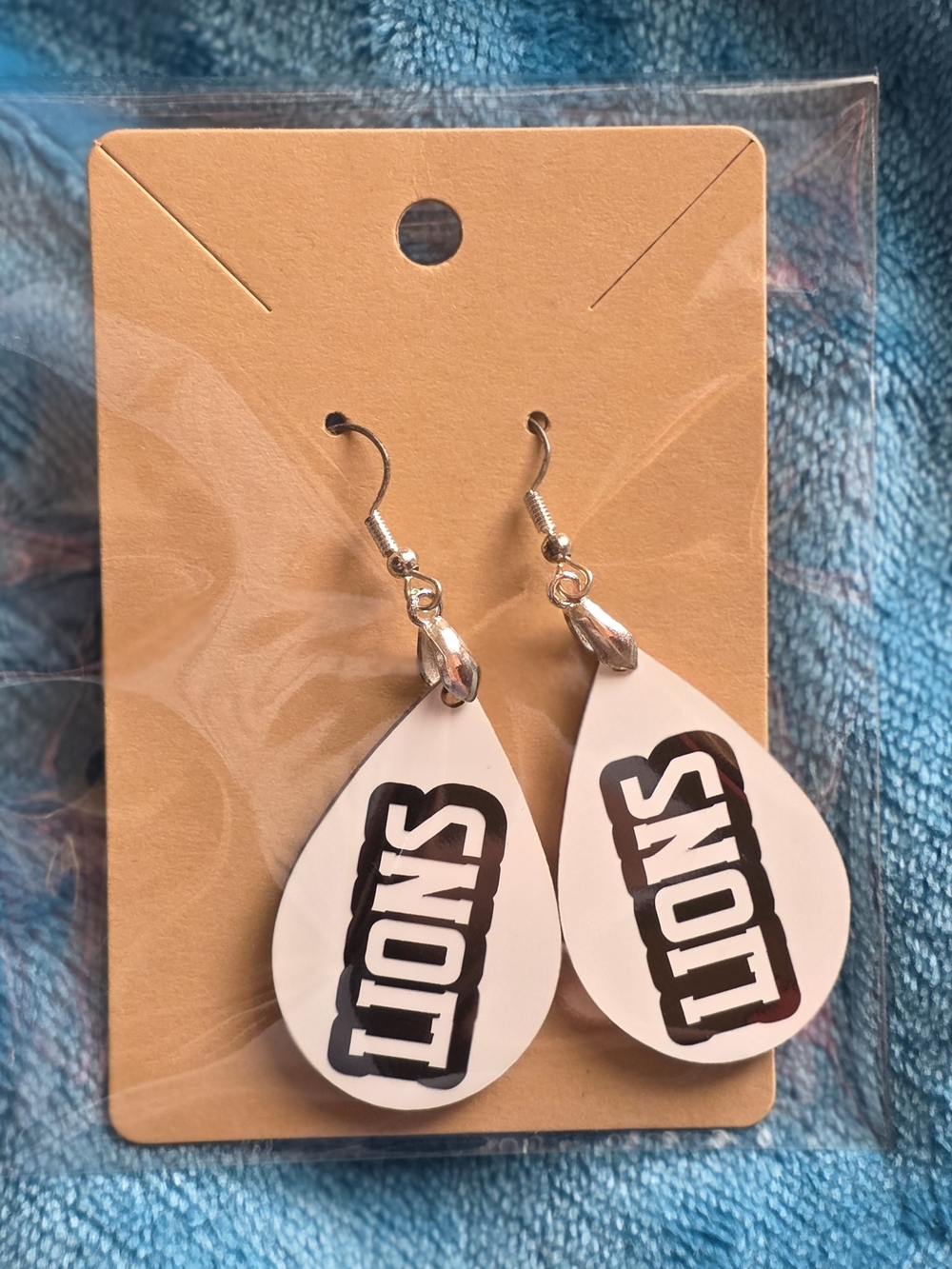 White Teardrop 'LIONS' Earrings with Silver Hooks